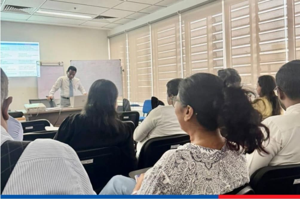 Empowering effective leadership through conflict management training session at People’s Insurance PLC with employees attending a professional workshop
